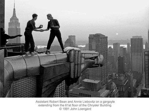 Assistant Robert Bean and Annie Liebovitz on a gargoyle extending from the 61st floor of the Chrysler Building.