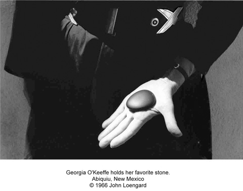 Georgia O'Keeffe holds her favorite stone.