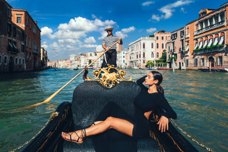 Model on a gondola in Venice, Italy. (Photo by Jeff Lombardo)