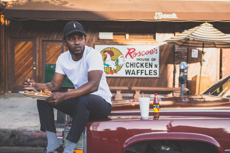 Kendrick Lamar eating outside of Roscoe's in Los Angeles. (Photo by Jeff Lombardo)
