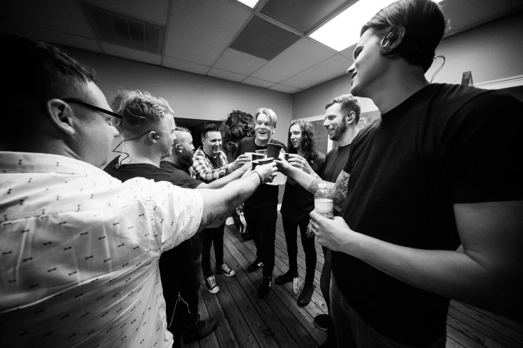 Underoath and Josh Scogin of '68 make a toast before their show on March 16, 2016 at Jannus Live in St. Petersburg, Florida