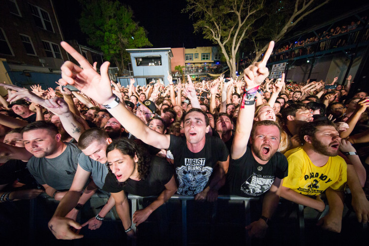 Fans cheer and sing along with Underoath as they perform on March 16, 2016 at Jannus Live in St. Petersburg, Florida