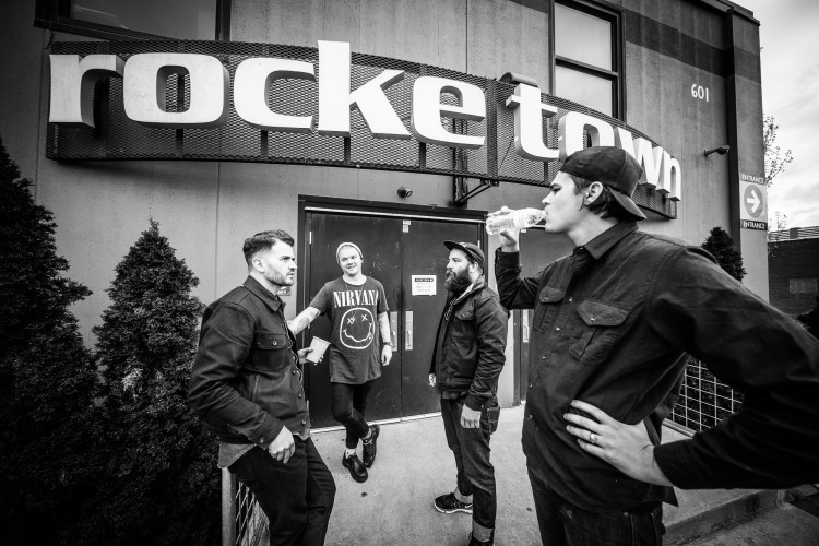 Jay Vilardi of The Almost, Aaron Gillespie of Underoath and The Almost, and Tim McTague and James Smith of Underoath chat outside Rocketown on April 11, 2016 in Nashville, Tennessee