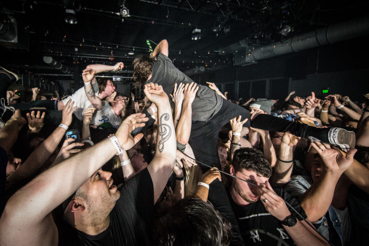 Spencer Chamberlain of Underoath jumps into the crowd on April 11, 2016 at Rocketown in Nashville, Tennessee