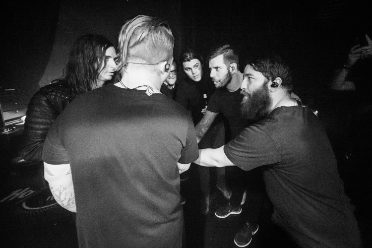 Spencer Chamberlain, Aaron Gillespie, Chris Dudley (hidden) guitar tech Josiah Ronco, James Smith, Grant Brandell, and Tim McTague of Underoath prepare to take the stage on April 24, 2016 at Hard Rock Live in Orlando, Florida